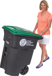 Photo of Mayor Stothert with a green lid recycling cart